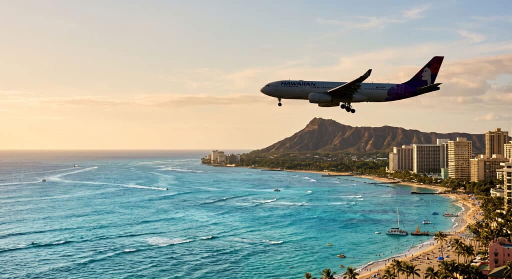 Airplane approaching Honolulu with Diamond Head and Waikiki coastline